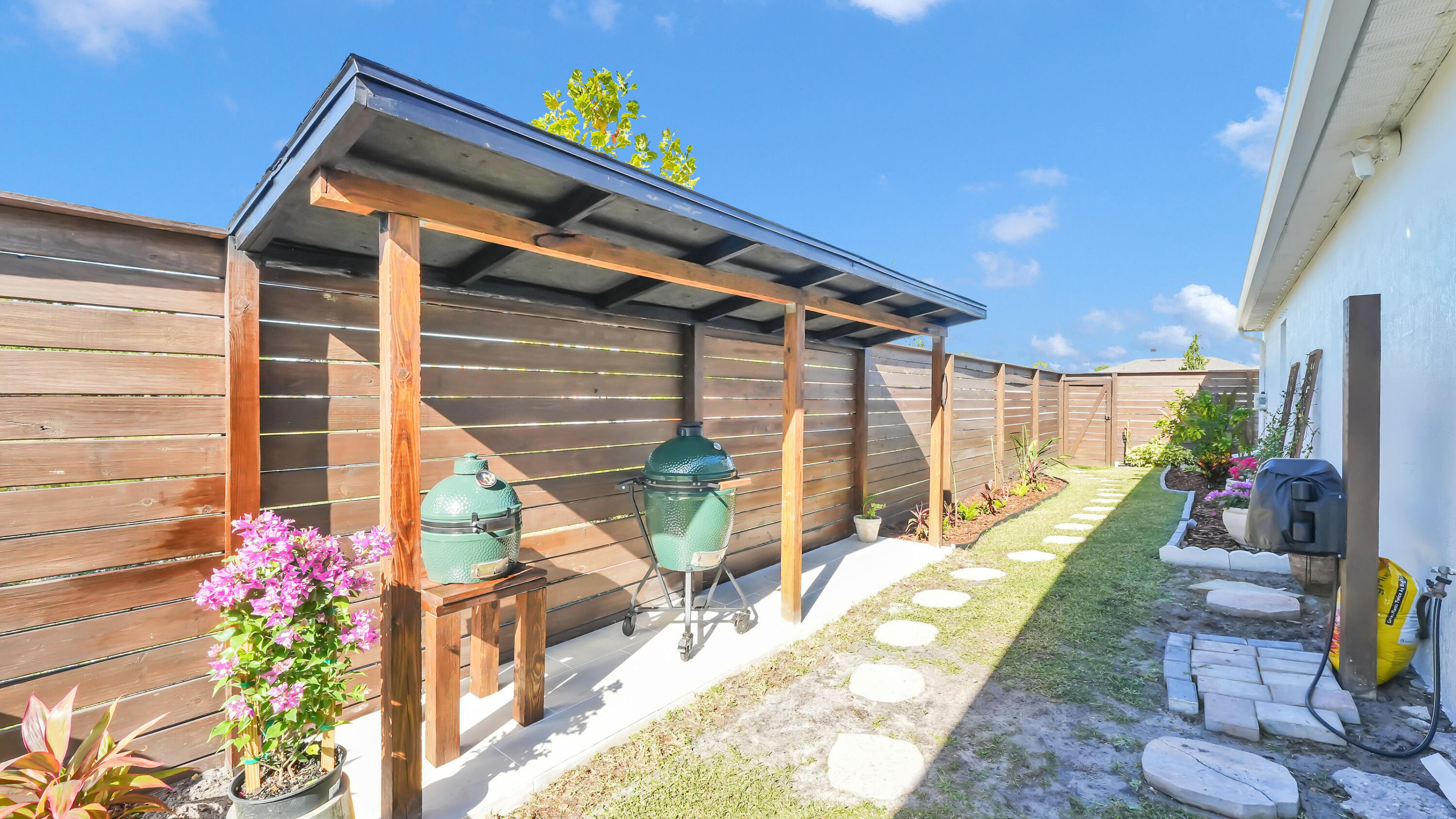 1382 Southwest Becker Road Port St. Lucie, FL 34953 - Photo 39 of 56 a backyard of a house with seating space