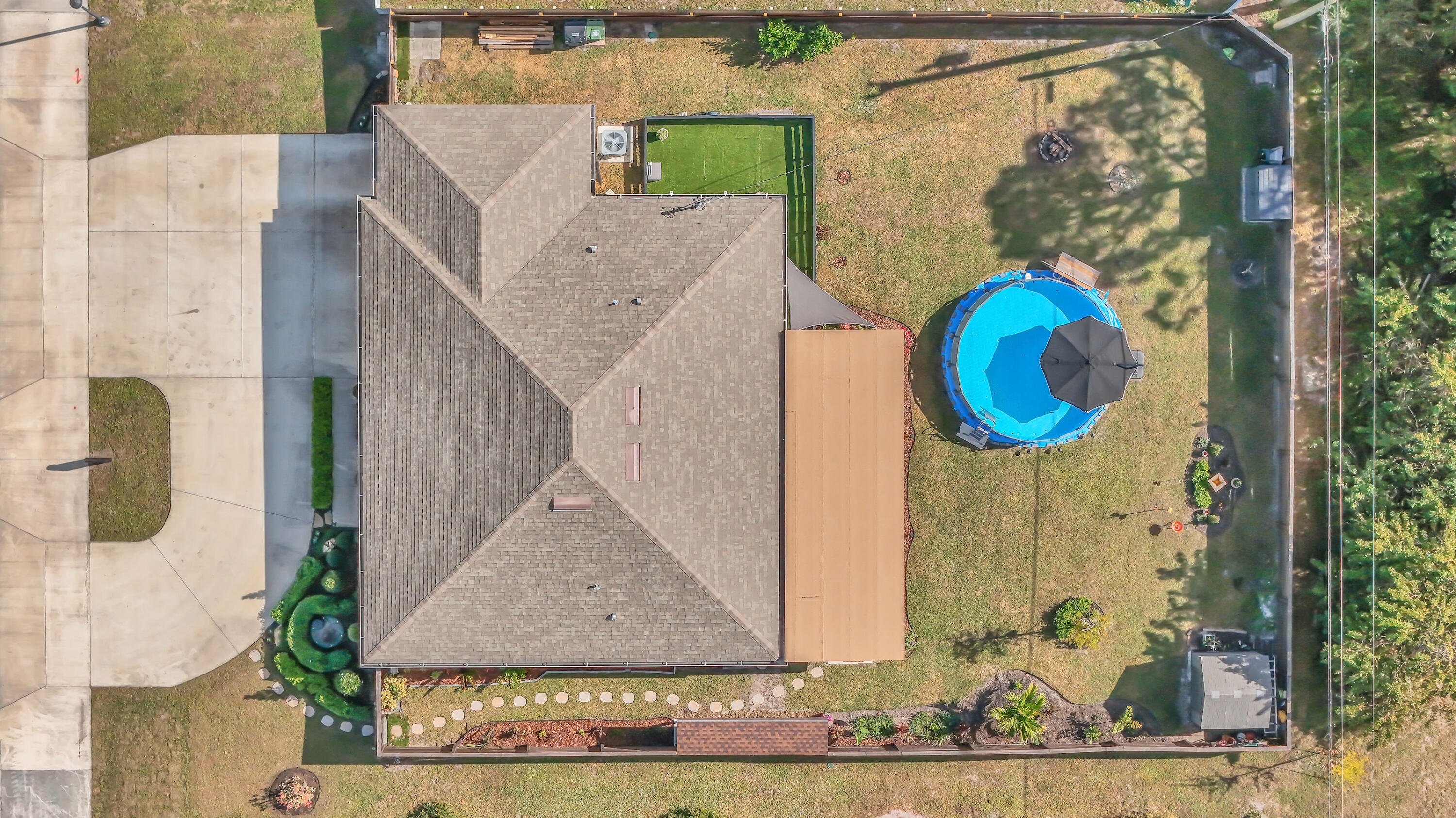 1382 Southwest Becker Road Port St. Lucie, FL 34953 - Photo 40 of 56 aerial view of a house with a backyard space and sitting space