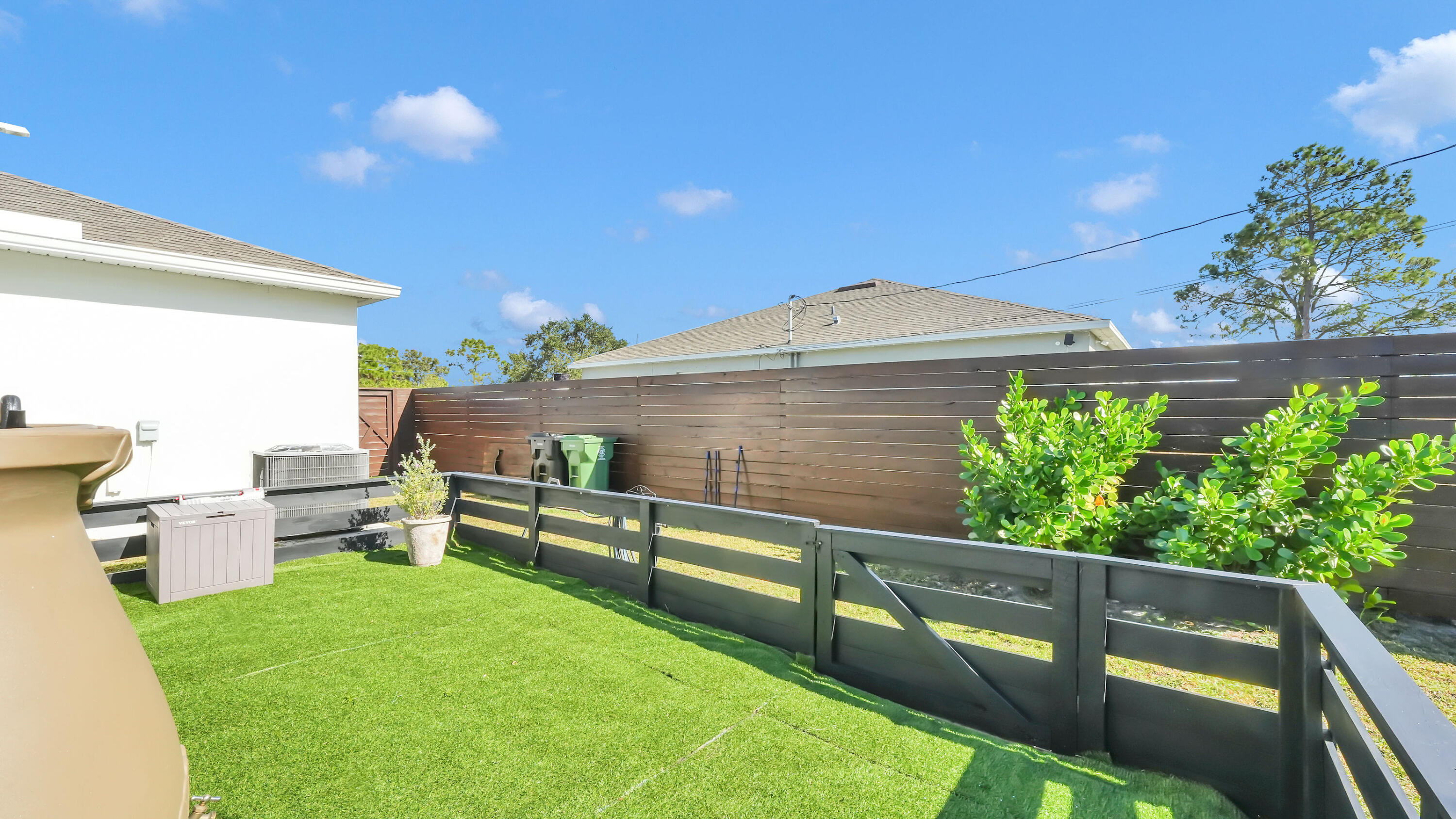1382 Southwest Becker Road Port St. Lucie, FL 34953 - Photo 49 of 56 a view of a backyard with sitting area