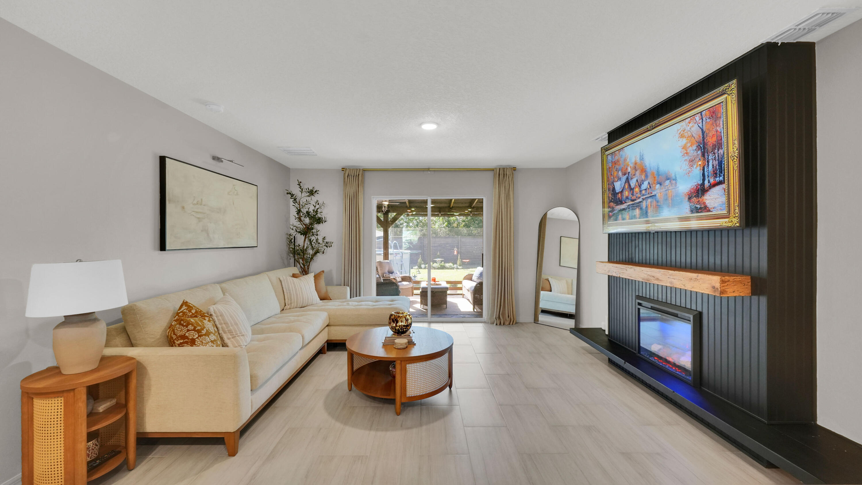 1382 Southwest Becker Road Port St. Lucie, FL 34953 - Photo 10 of 56 a living room with furniture and a fireplace