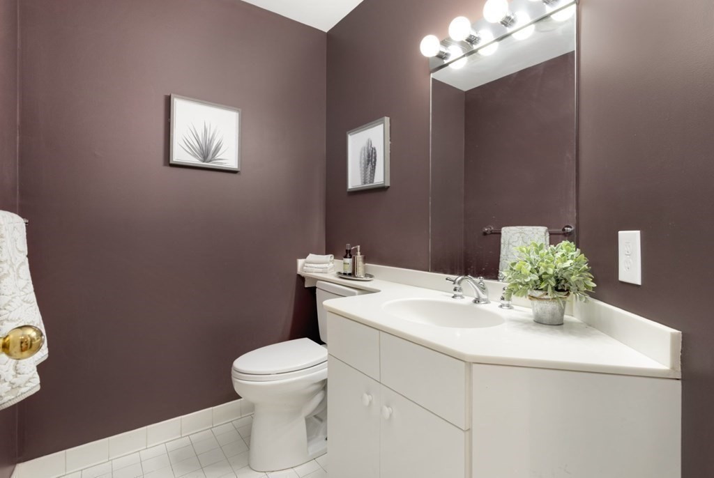 81 Algonquin Road, Unit 81 Newton, MA 02467 - Photo 12 of 40 a bathroom with a sink a toilet and mirror