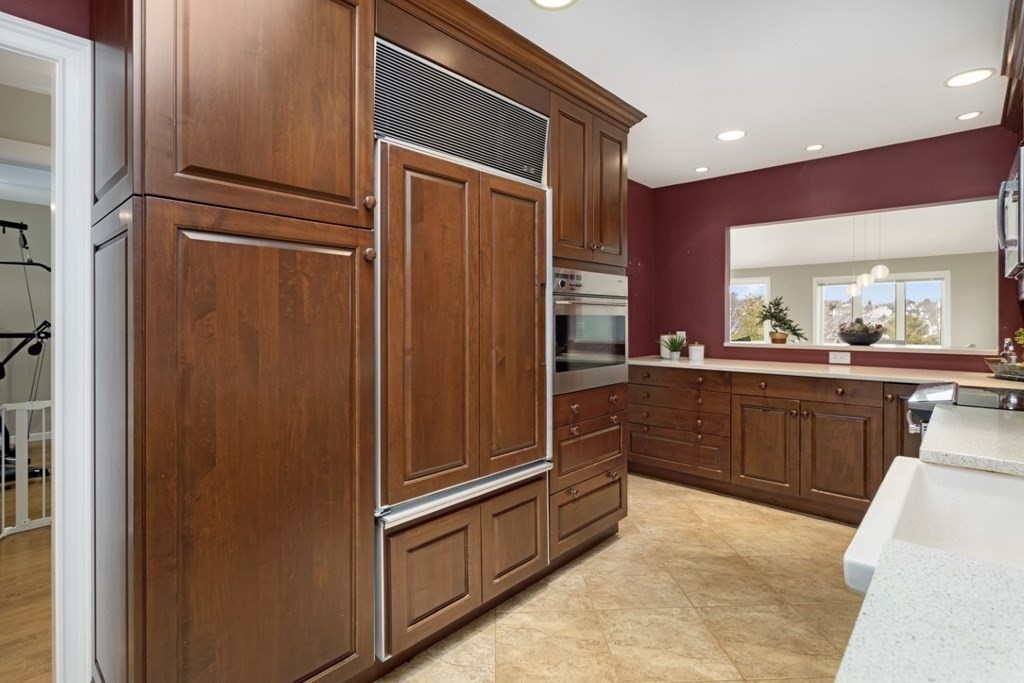 81 Algonquin Road, Unit 81 Newton, MA 02467 - Photo 15 of 40 a kitchen with stainless steel appliances granite countertop a refrigerator and a sink