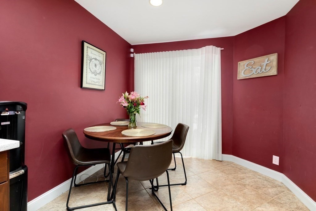 81 Algonquin Road, Unit 81 Newton, MA 02467 - Photo 16 of 40 a view of a room with a table and chairs