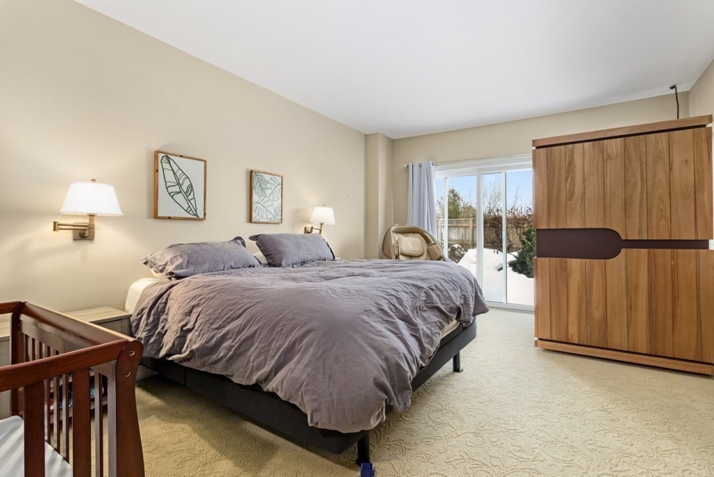 81 Algonquin Road, Unit 81 Newton, MA 02467 - Photo 19 of 40 a bedroom with a bed and a window
