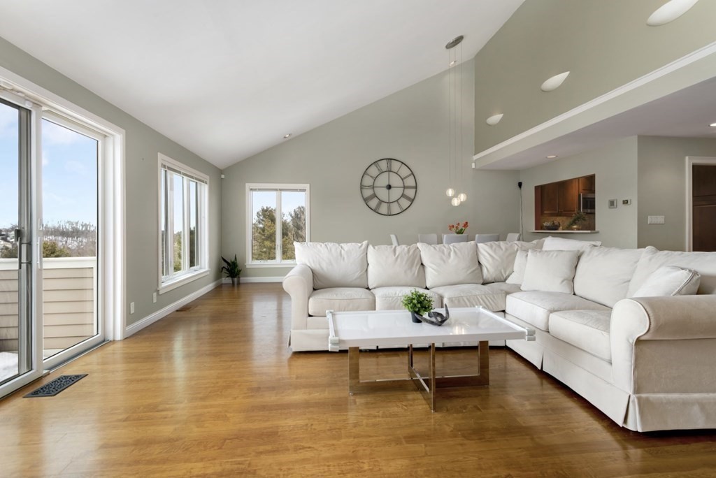 81 Algonquin Road, Unit 81 Newton, MA 02467 - Photo 2 of 40 a living room with furniture and a large window