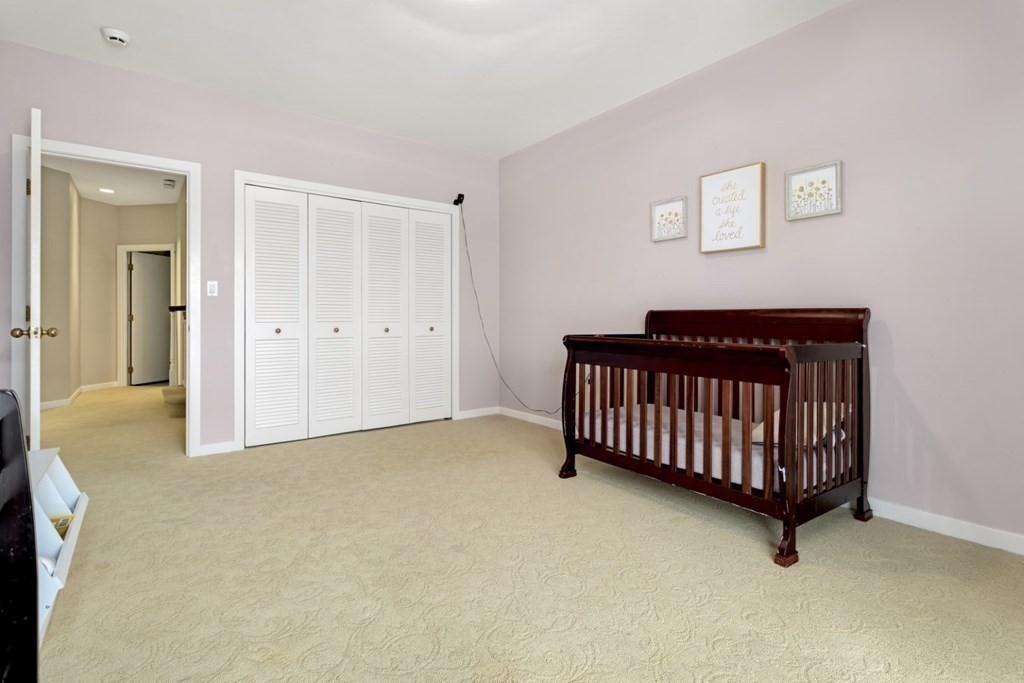 81 Algonquin Road, Unit 81 Newton, MA 02467 - Photo 25 of 40 a bed room with a bed and a window