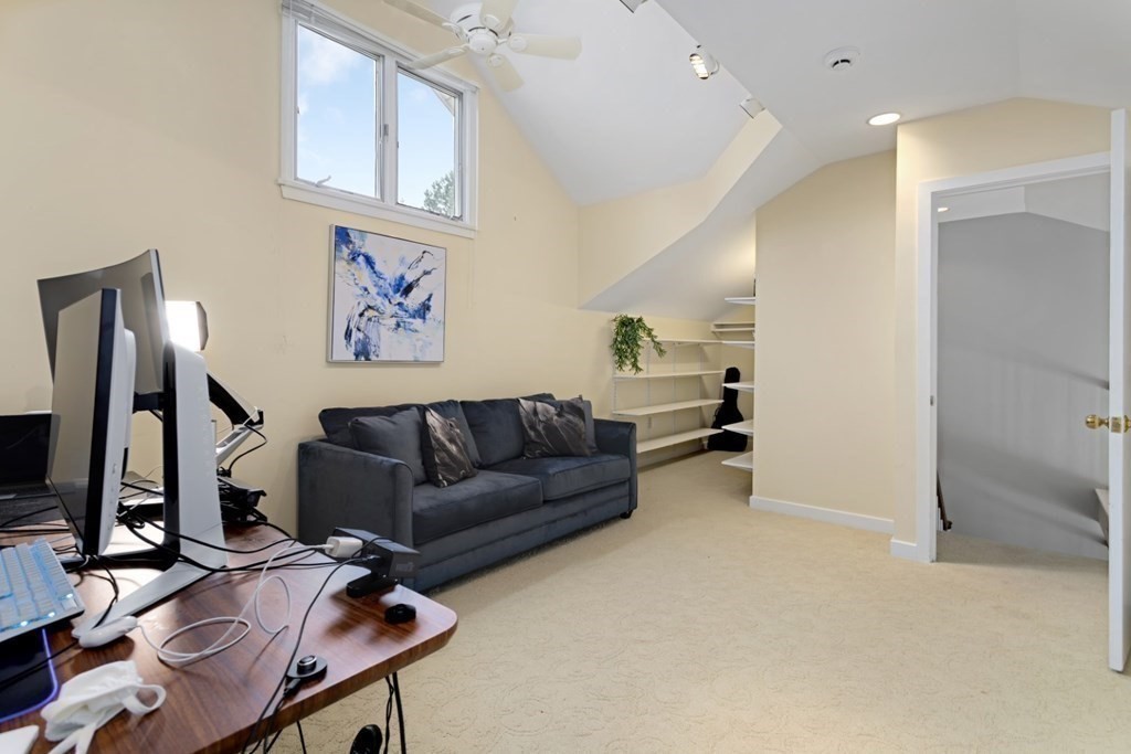 81 Algonquin Road, Unit 81 Newton, MA 02467 - Photo 28 of 40 a living room with furniture and a flat screen tv