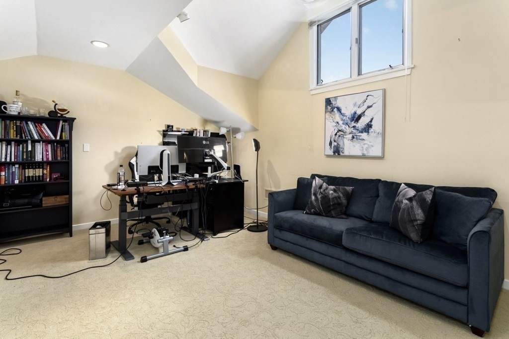 81 Algonquin Road, Unit 81 Newton, MA 02467 - Photo 29 of 40 a view of a living room and workspace