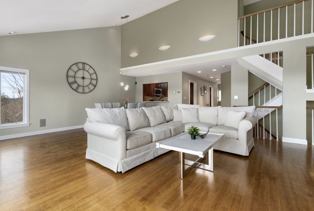 81 Algonquin Road, Unit 81 Newton, MA 02467 - Photo 3 of 40 a living room with furniture and wooden floor