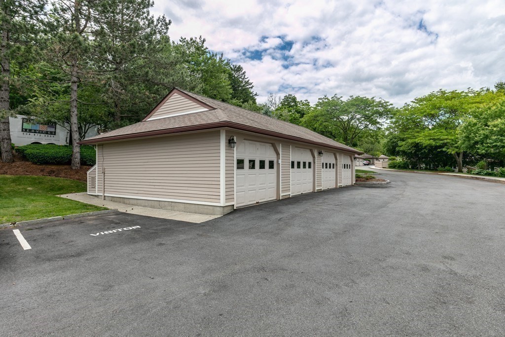 81 Algonquin Road, Unit 81 Newton, MA 02467 - Photo 36 of 40 a view of a house with backyard