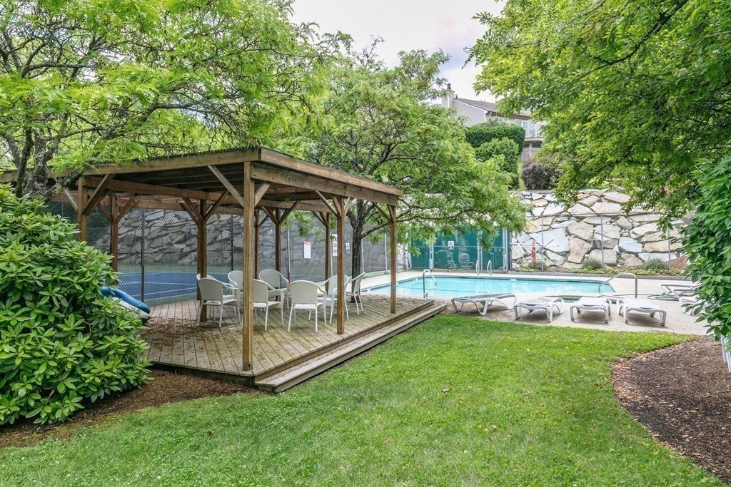 81 Algonquin Road, Unit 81 Newton, MA 02467 - Photo 38 of 40 a view of an house with backyard space and garden