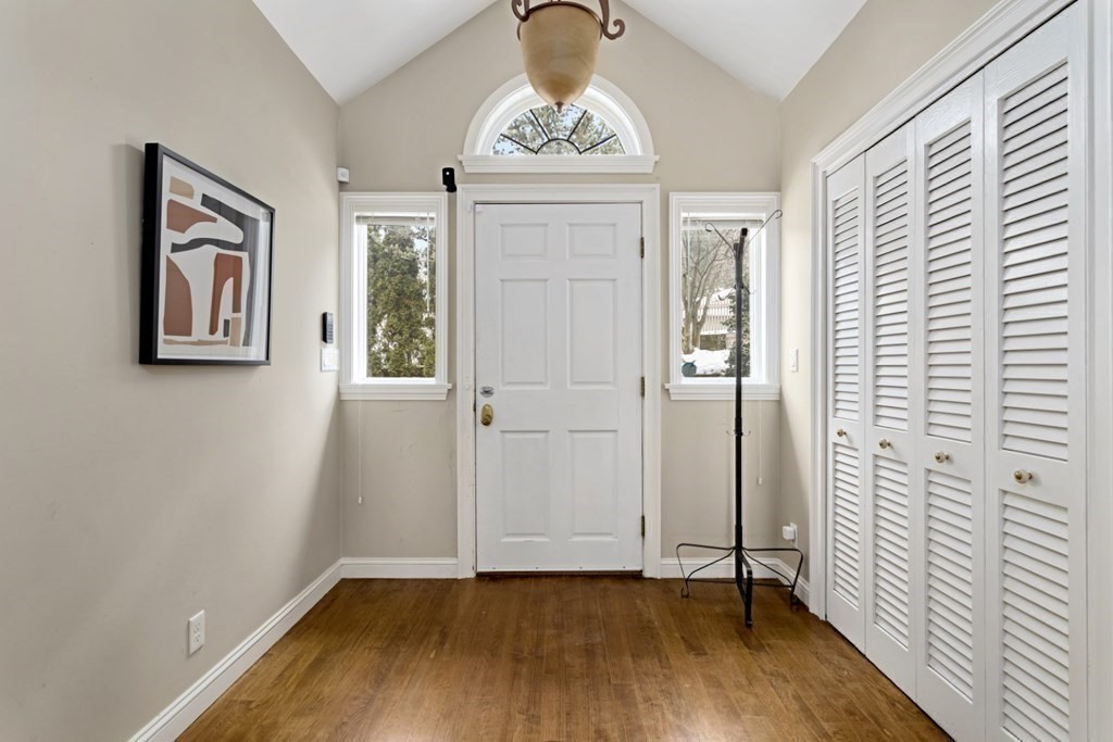 81 Algonquin Road, Unit 81 Newton, MA 02467 - Photo 8 of 40 an empty room with wooden floor closet and windows