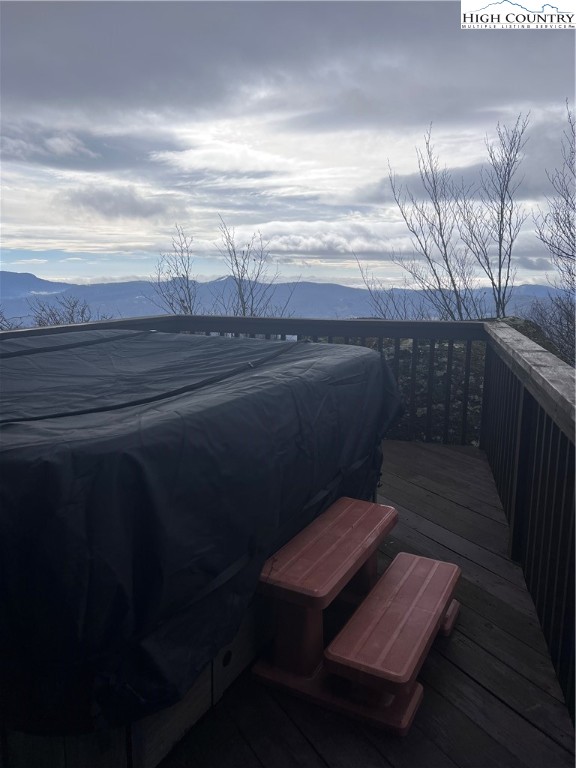 126 Oz Road Beech Mountain, NC 28604 - Photo 14 of 50 a view of a balcony with wooden floor