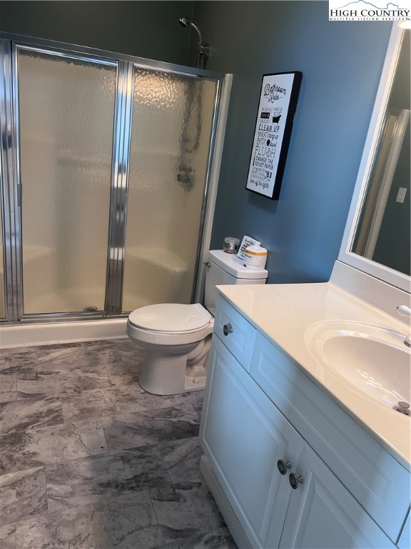 126 Oz Road Beech Mountain, NC 28604 - Photo 17 of 50 a bathroom with a sink and a toilet