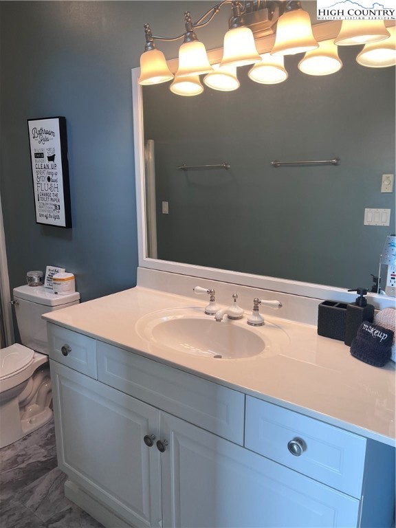 126 Oz Road Beech Mountain, NC 28604 - Photo 18 of 50 a bathroom with a sink and a mirror