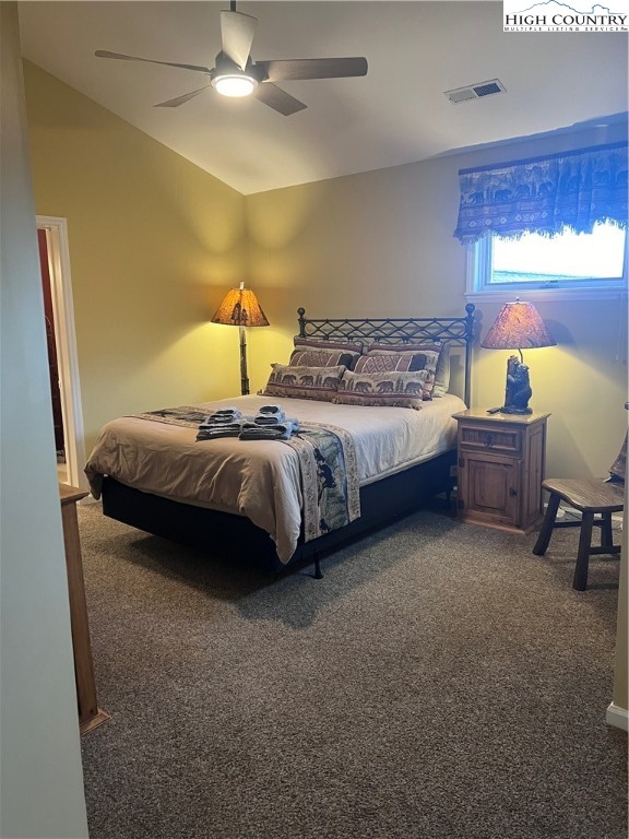 126 Oz Road Beech Mountain, NC 28604 - Photo 19 of 50 a spacious bedroom with a bed and a window