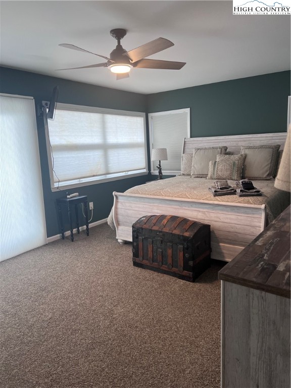 126 Oz Road Beech Mountain, NC 28604 - Photo 9 of 50 a spacious bedroom with a bed and window