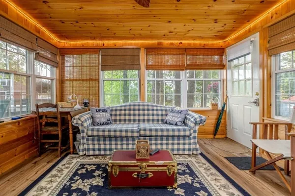 a kitchen with stainless steel appliances granite countertop a refrigerator a stove and a sink with wooden floor