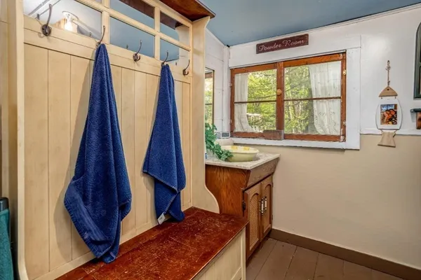 a bedroom with furniture and large windows