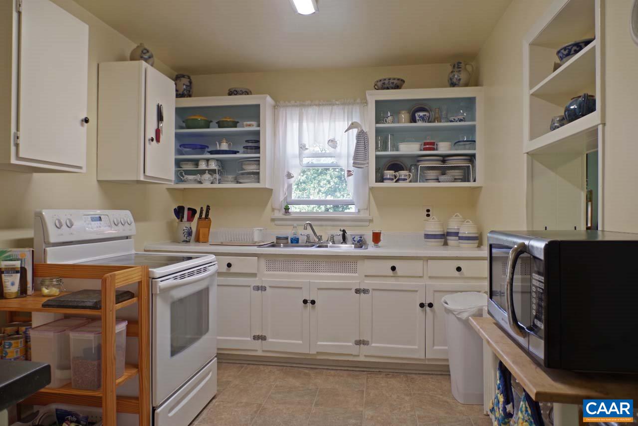 88 Court Street Lovingston, VA 22949 - Photo 13 of 44 a kitchen with stainless steel appliances a stove a sink and a refrigerator