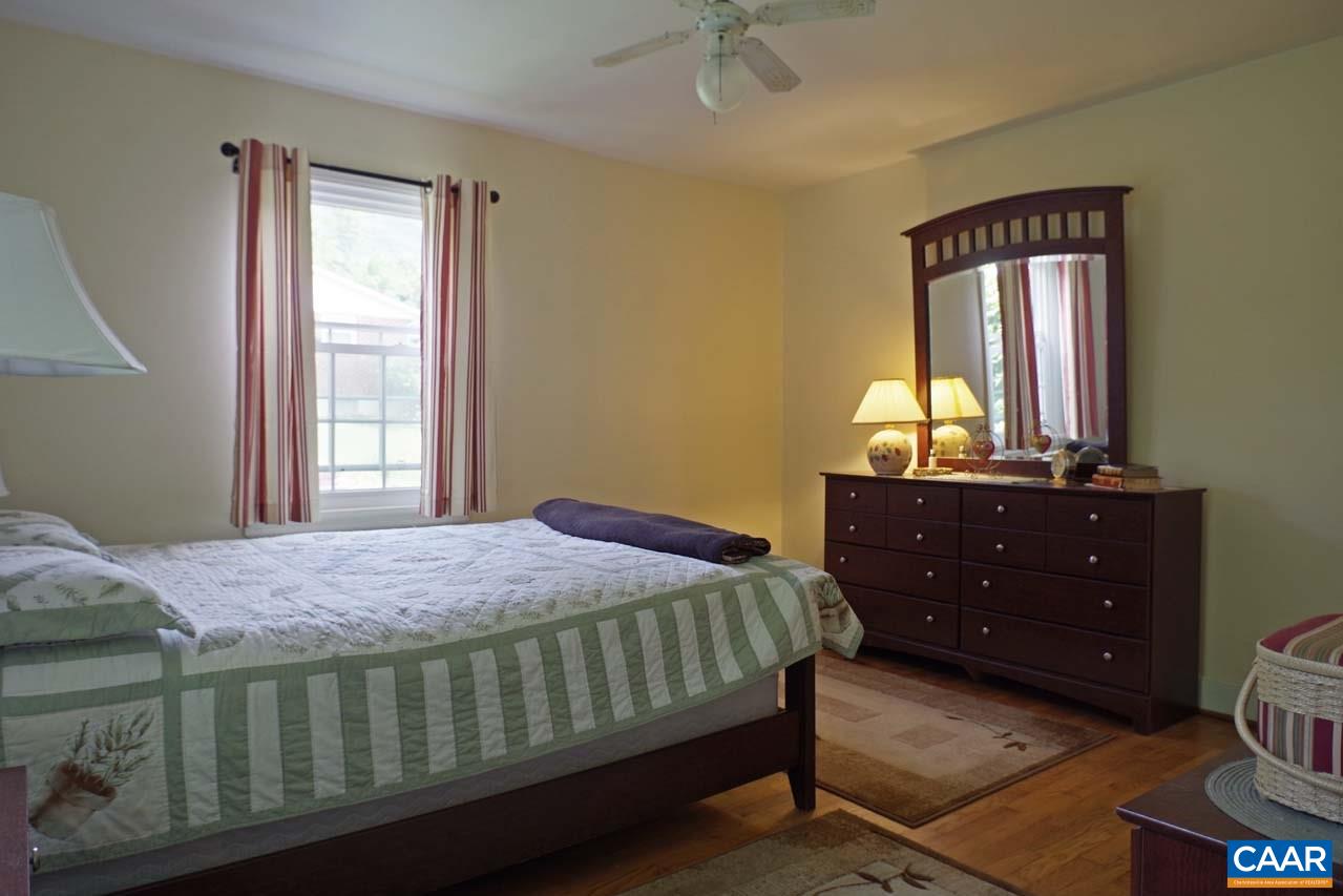88 Court Street Lovingston, VA 22949 - Photo 23 of 44 a bedroom with a bed and a dresser