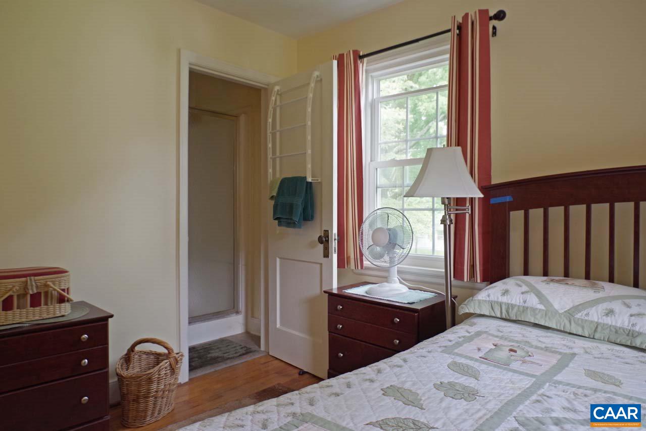 88 Court Street Lovingston, VA 22949 - Photo 24 of 44 a bedroom with a bed and a dresser