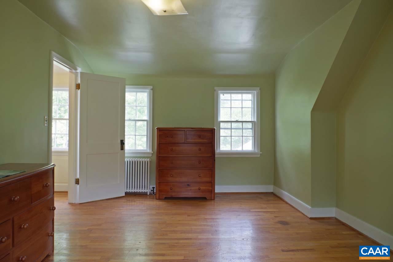 88 Court Street Lovingston, VA 22949 - Photo 33 of 44 an empty room with wooden floor and windows