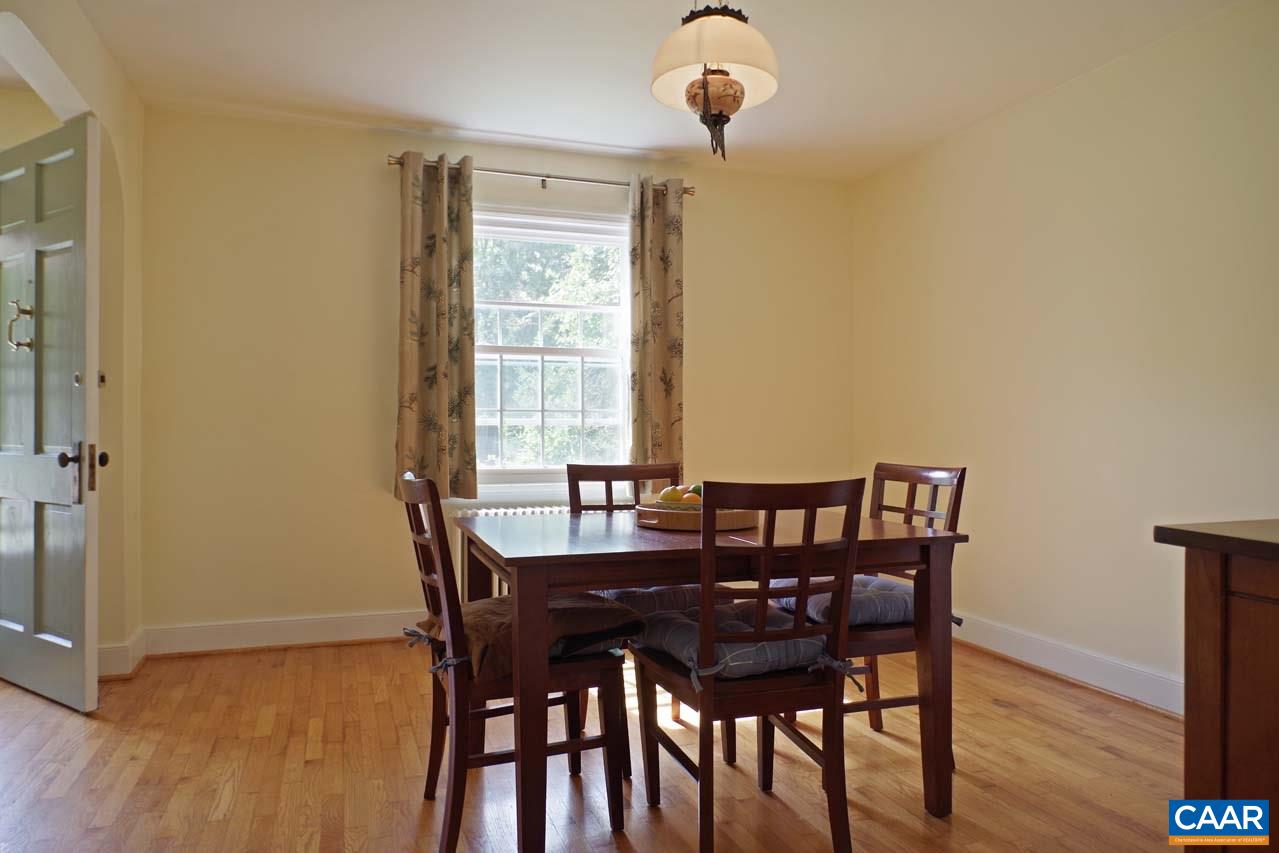 88 Court Street Lovingston, VA 22949 - Photo 8 of 44 a view of a dining room with furniture and wooden floor