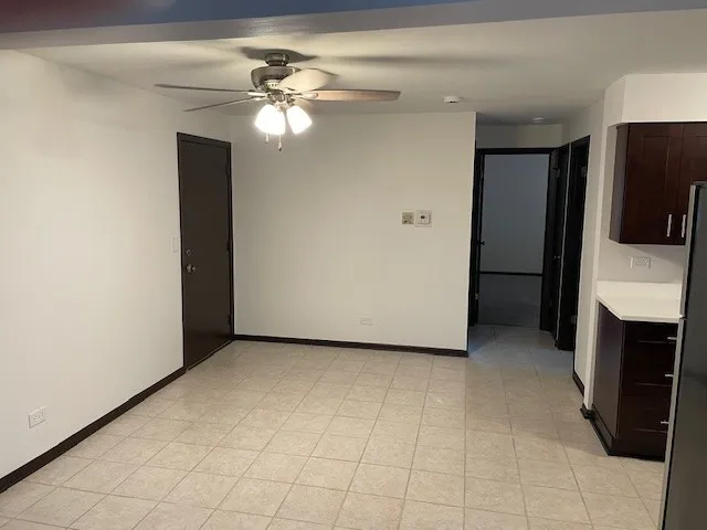 a view of an empty room with a fireplace