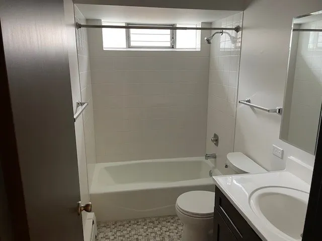 a bathroom with a sink a toilet and a bathtub