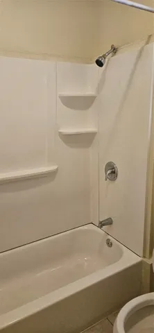 a bathroom with a bath tub