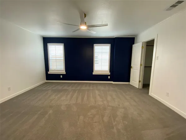 a bathroom with a sink toilet a mirror and shower