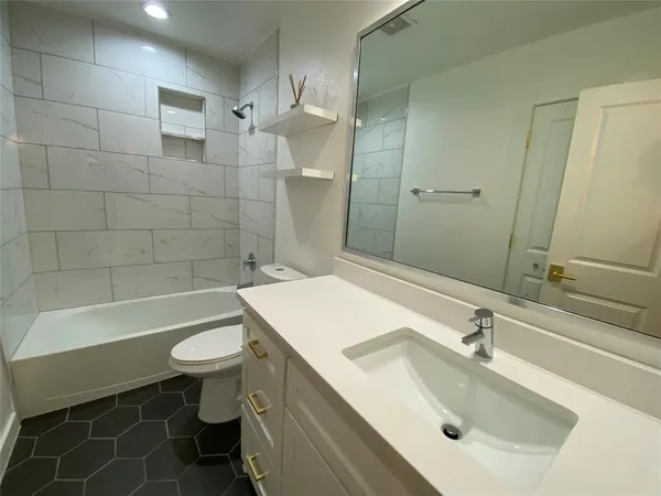 a view of backyard of house with green space