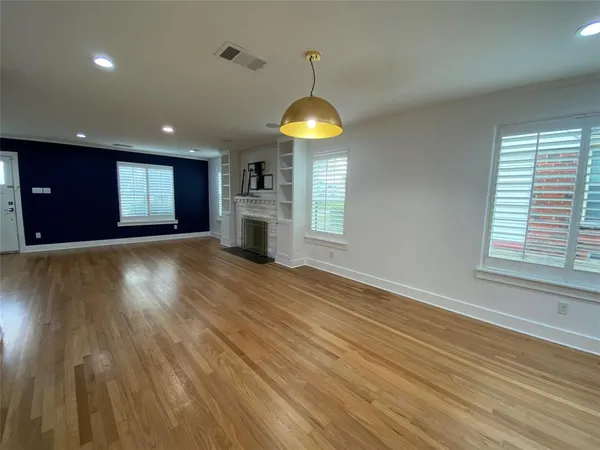 a large kitchen with stainless steel appliances granite countertop a stove and a sink