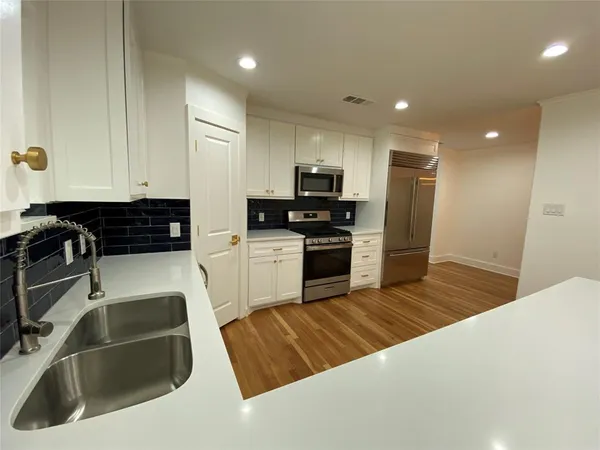a bathroom with a sink and a shower