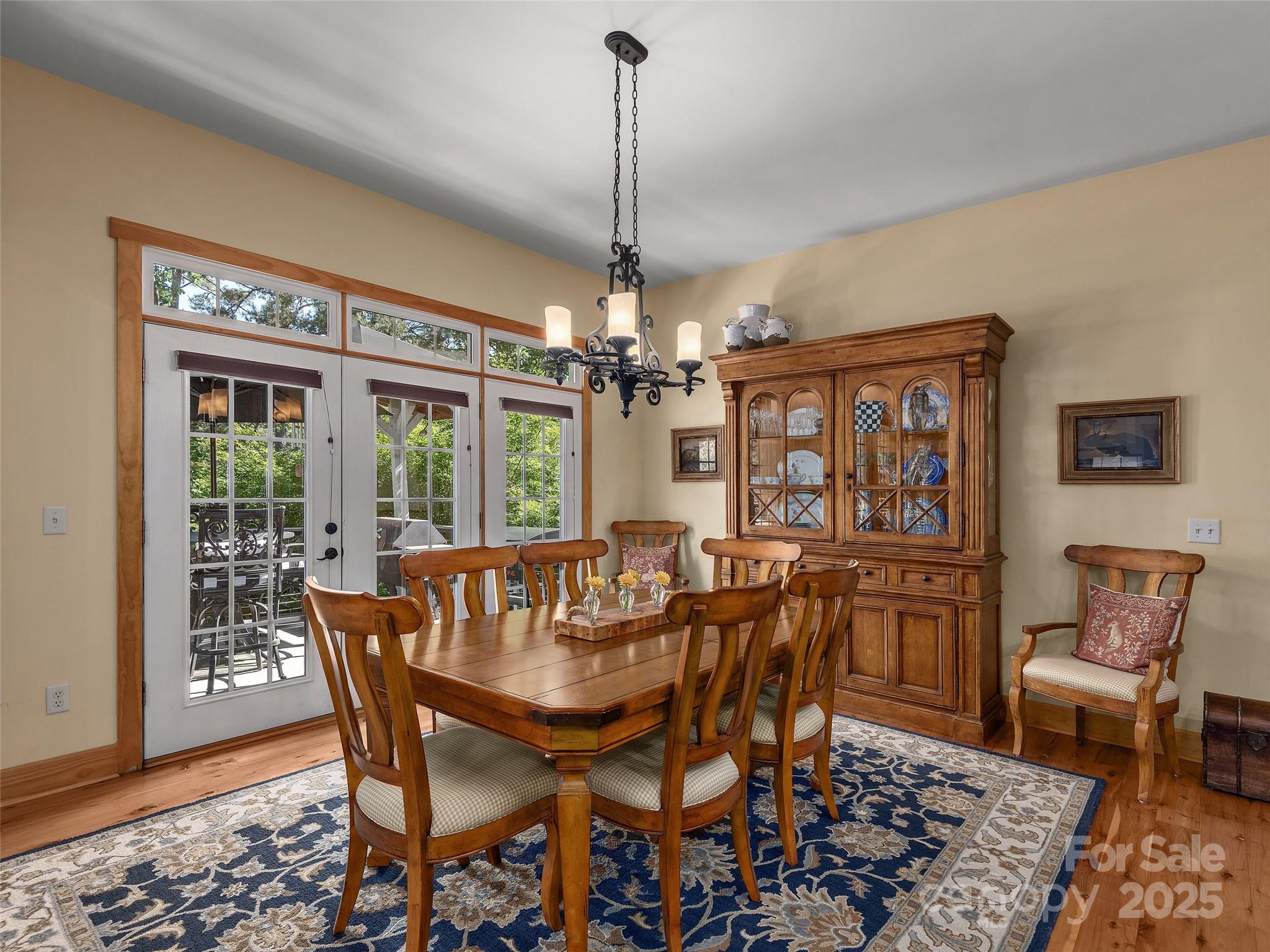92 Island View Court Mill Spring, NC 28756 - Photo 11 of 48 a view of a dining room with furniture window and wooden floor