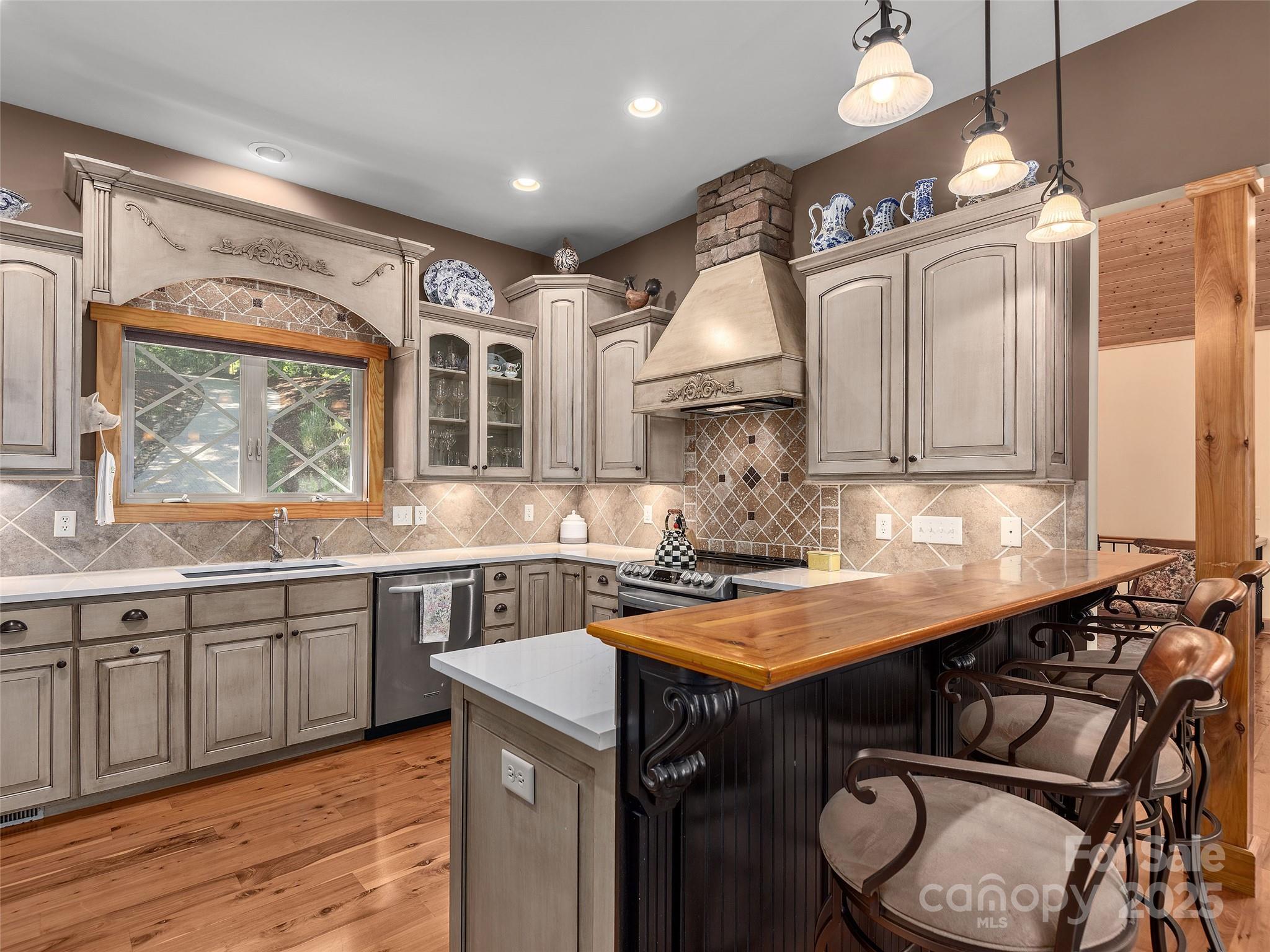 92 Island View Court Mill Spring, NC 28756 - Photo 13 of 48 a kitchen with a sink stove and cabinets