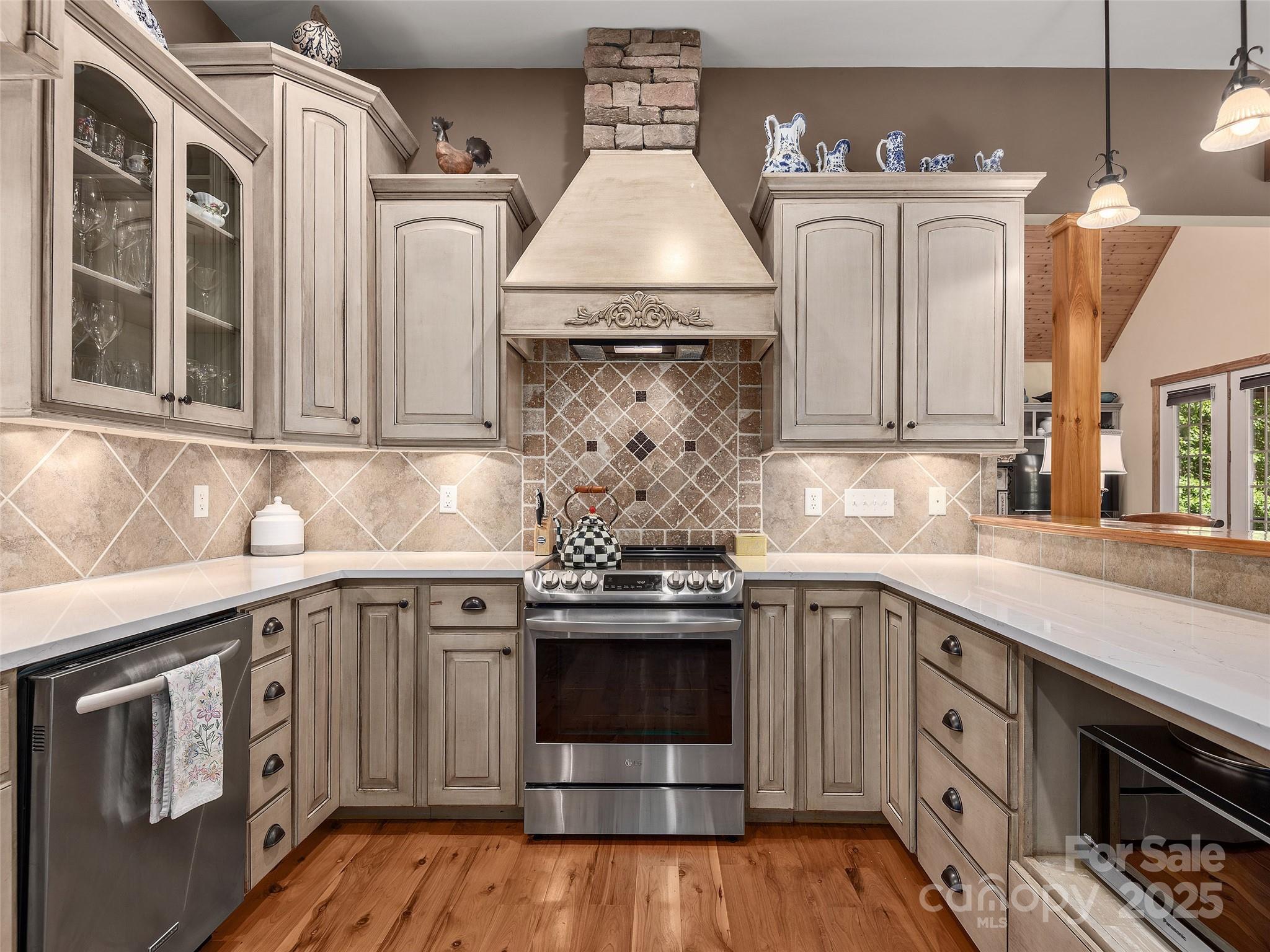 92 Island View Court Mill Spring, NC 28756 - Photo 14 of 48 a kitchen with stainless steel appliances granite countertop a stove and a sink