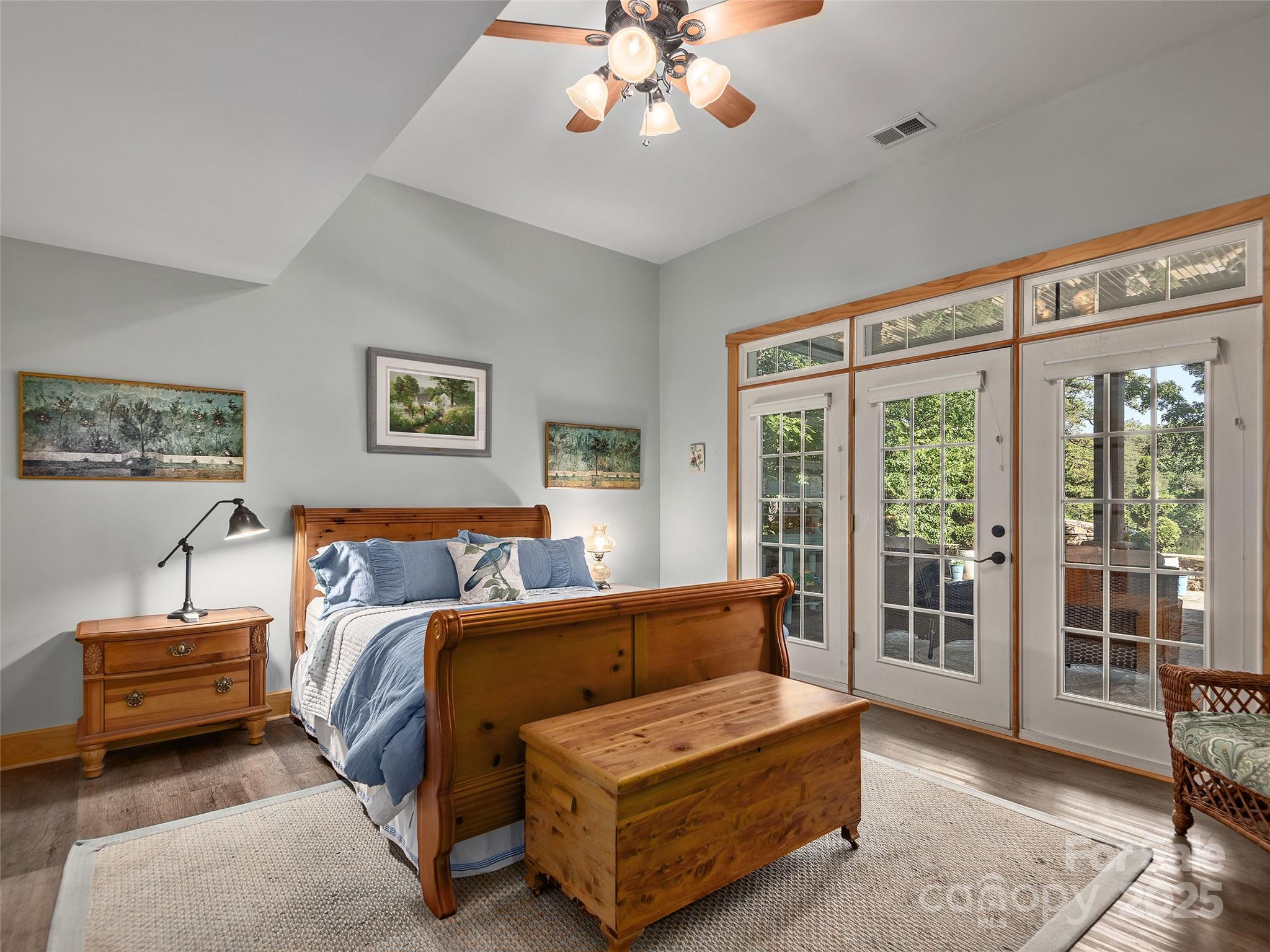 92 Island View Court Mill Spring, NC 28756 - Photo 21 of 48 a spacious bedroom with a bed and a large window