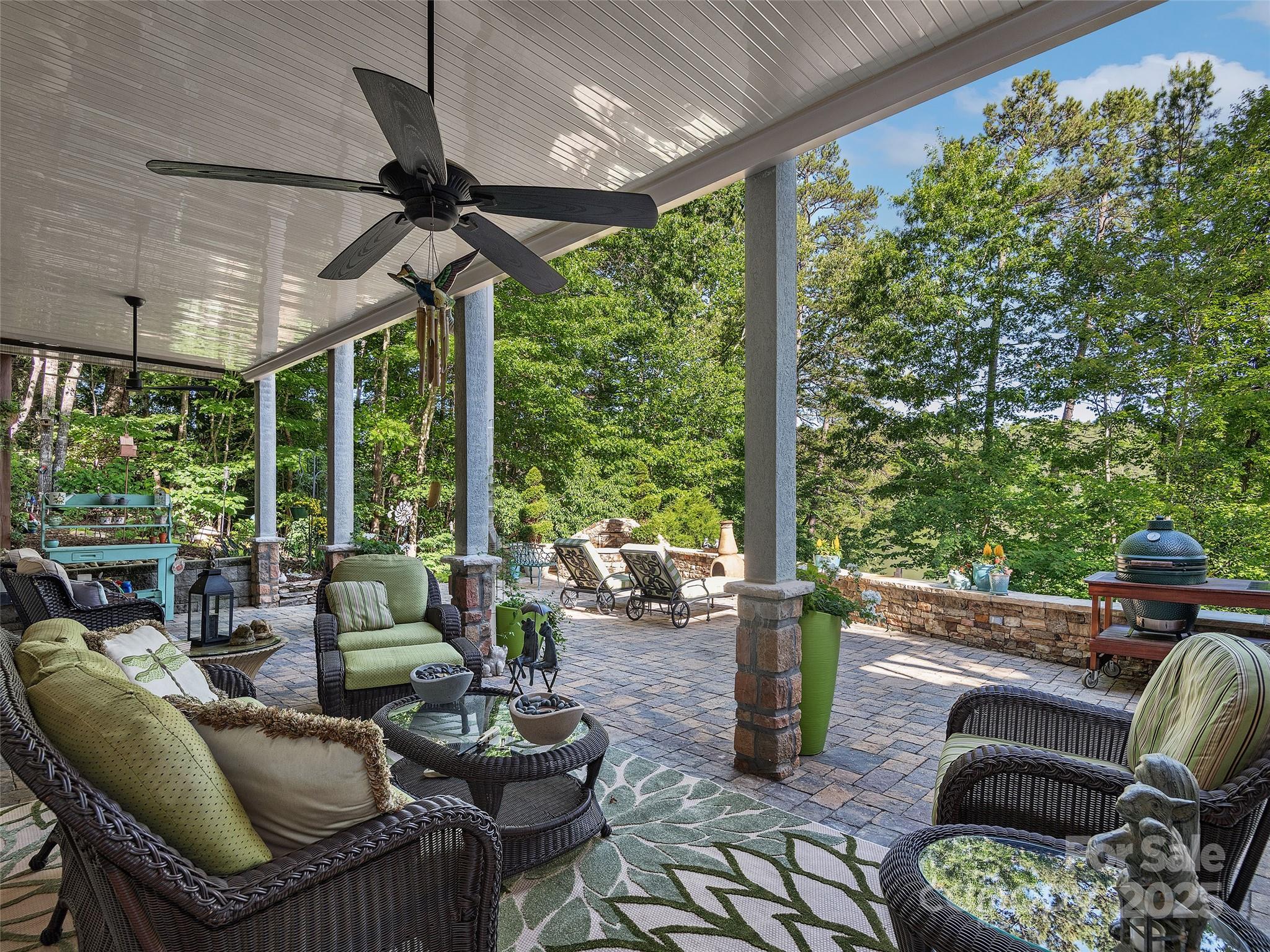 92 Island View Court Mill Spring, NC 28756 - Photo 27 of 48 a living room with furniture and a floor to ceiling window