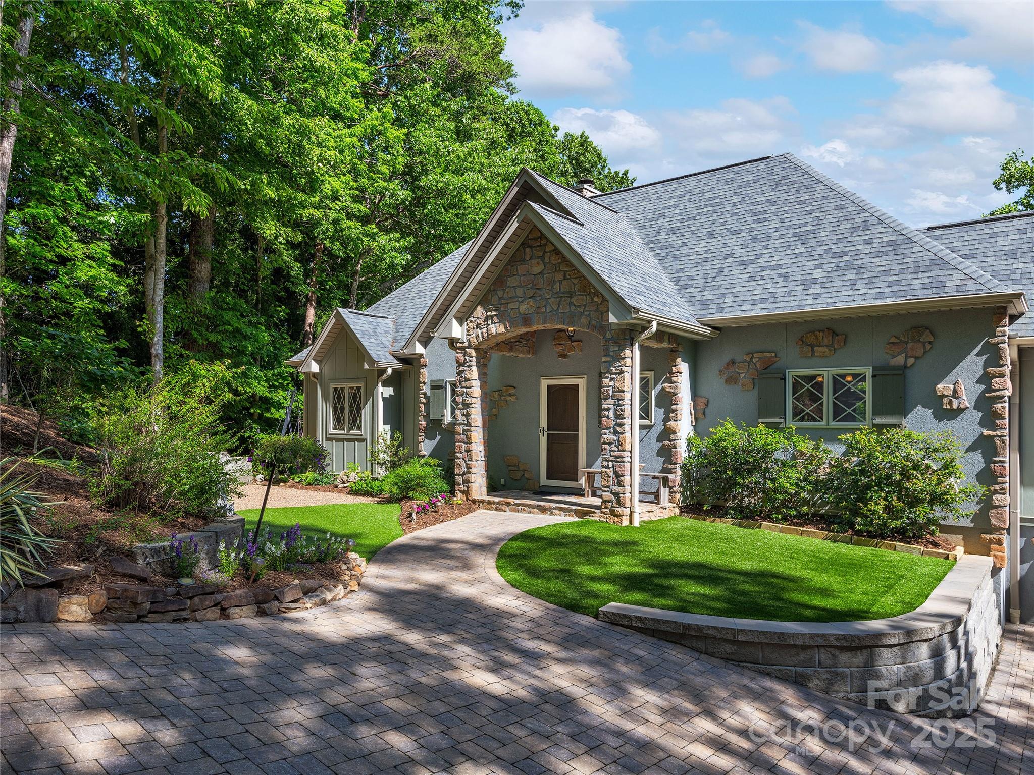 92 Island View Court Mill Spring, NC 28756 - Photo 3 of 48 a front view of a house with a yard and green space