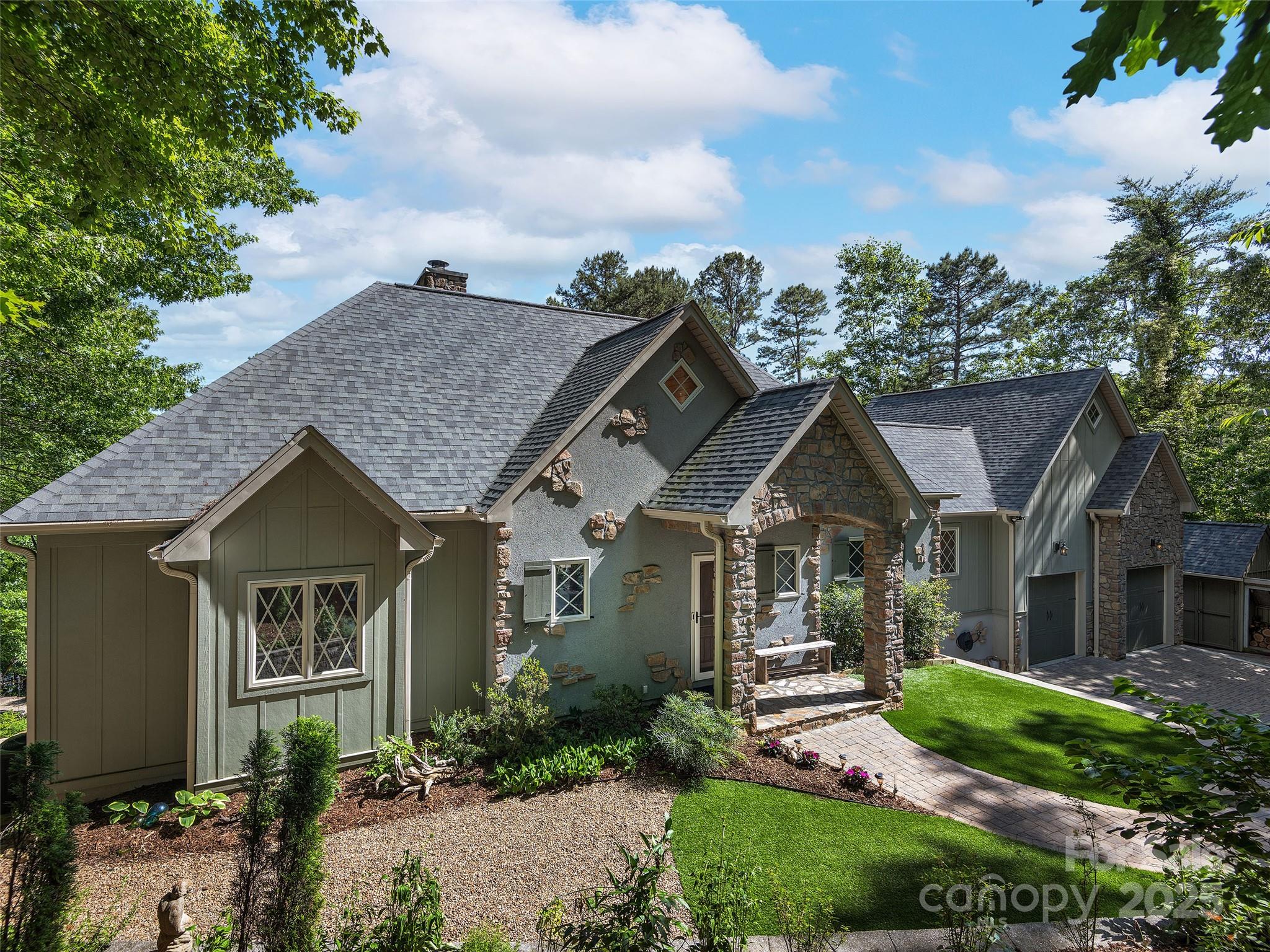 92 Island View Court Mill Spring, NC 28756 - Photo 34 of 48 a front view of a house with a garden