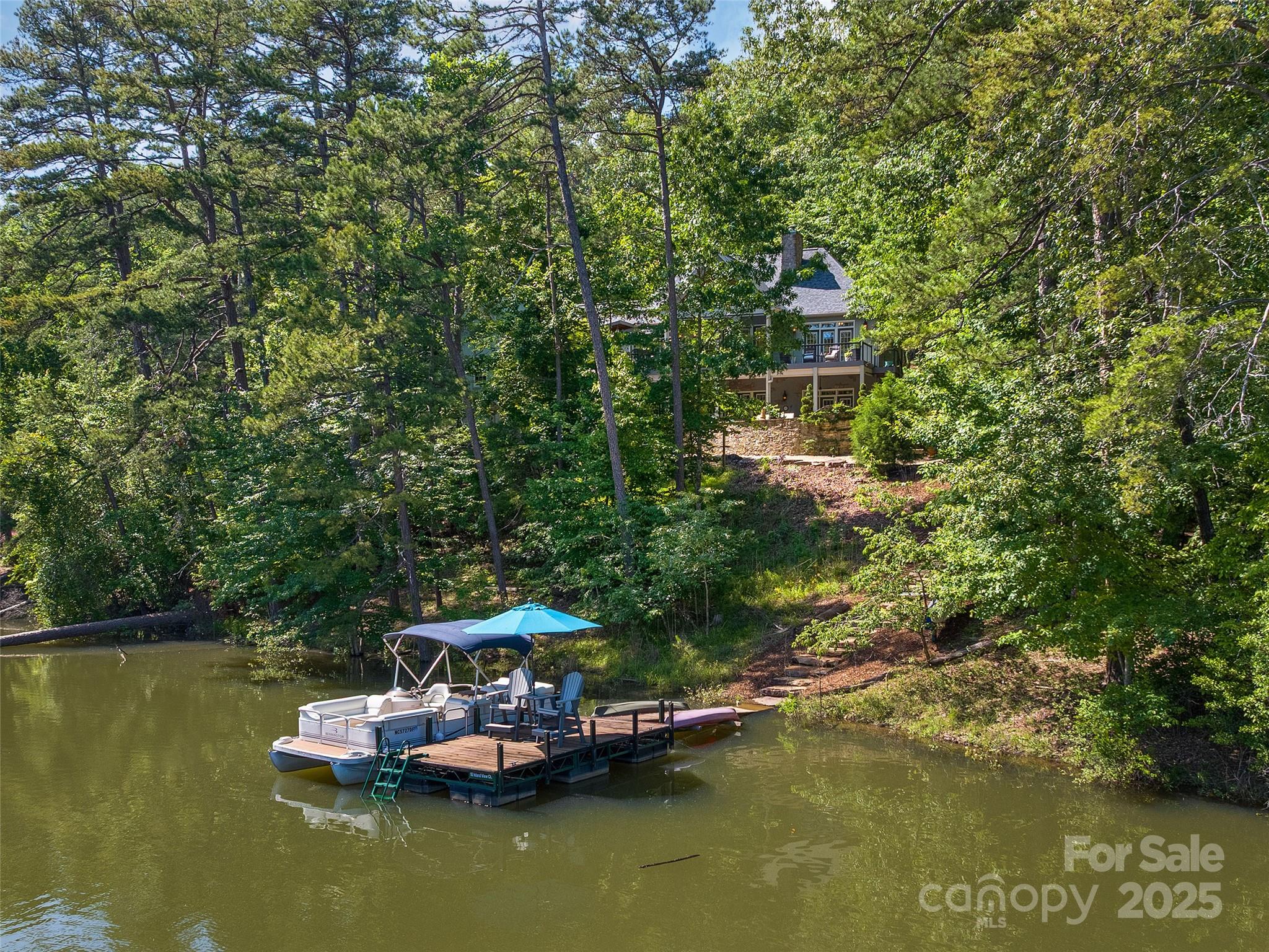 92 Island View Court Mill Spring, NC 28756 - Photo 39 of 48 a small swimming pool with some trees in the background