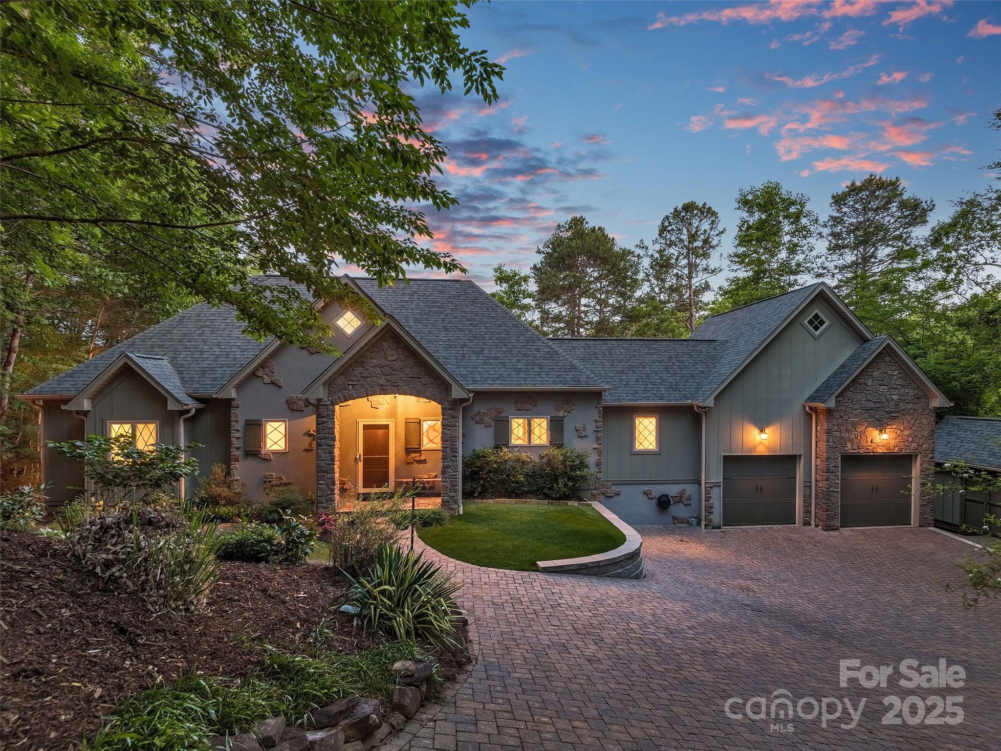 92 Island View Court Mill Spring, NC 28756 - Photo 42 of 48 a front view of a house with a yard and garage