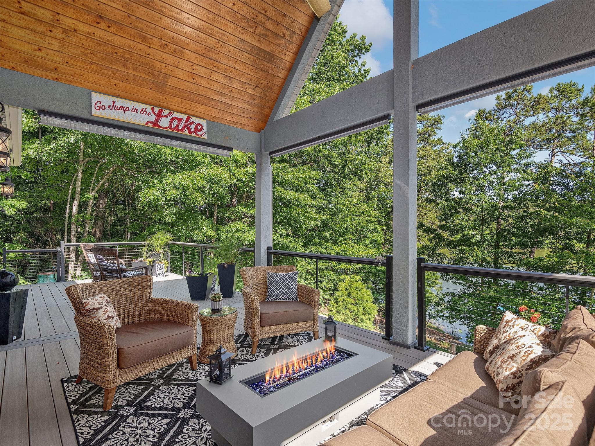 92 Island View Court Mill Spring, NC 28756 - Photo 7 of 48 a view of a patio with a table chairs and a table