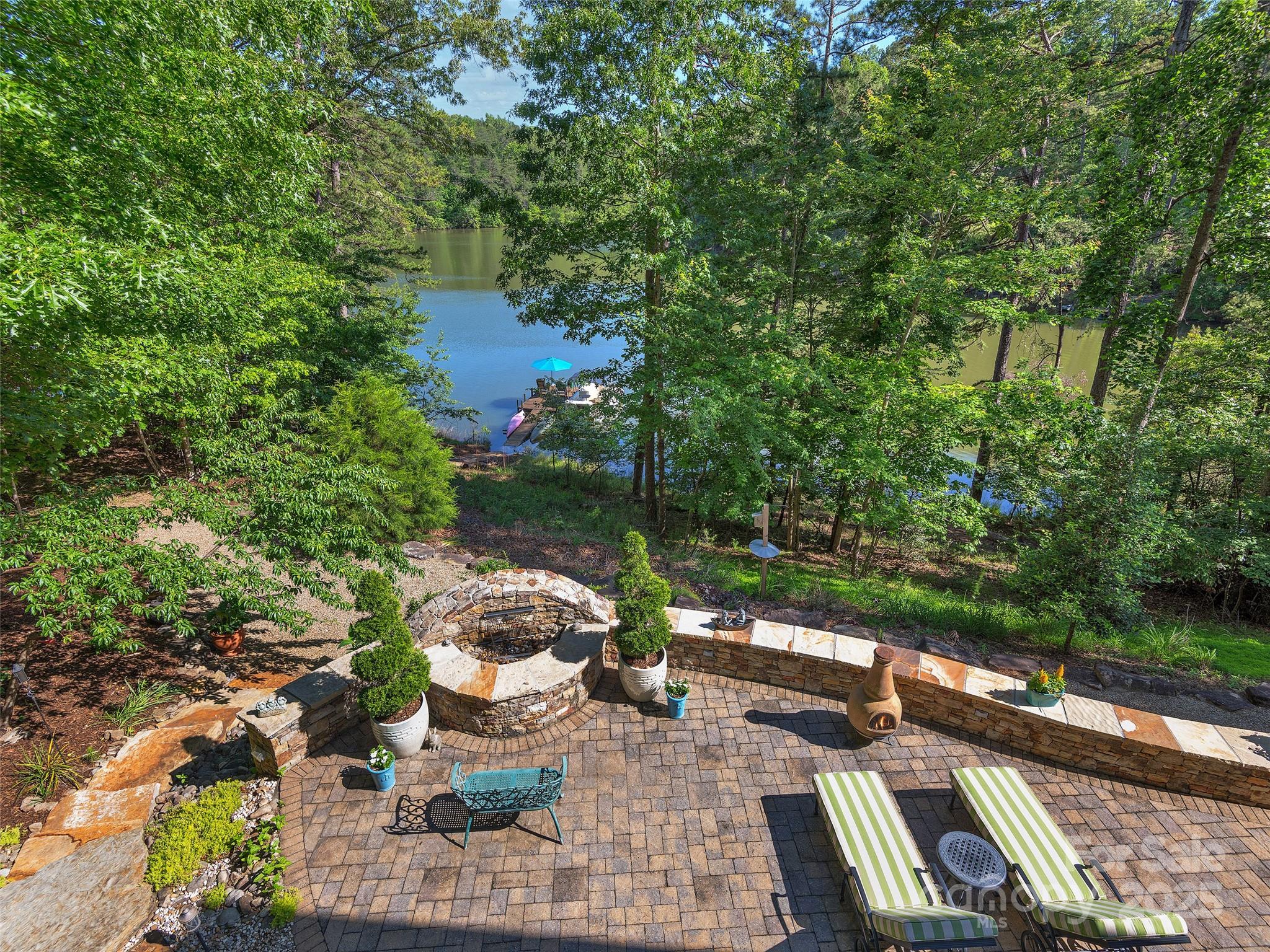 92 Island View Court Mill Spring, NC 28756 - Photo 9 of 48 a view of a patio with couches table and chairs and potted plants