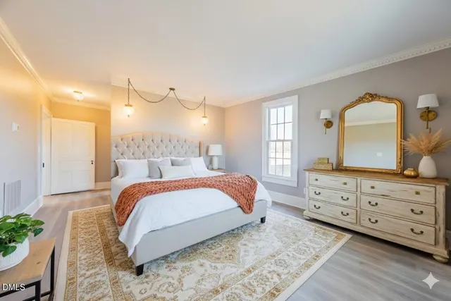 a bedroom with a bed and a dresser