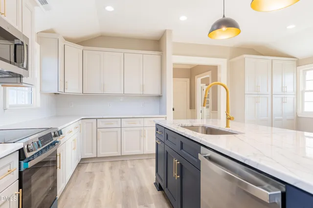 a kitchen with a sink cabinets and window