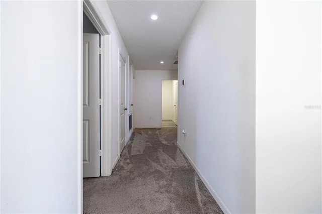 a bedroom with a bed and a tv