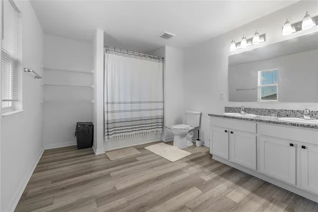 a view of bathroom with a sink and a toilet